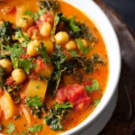 Tomato Coconut Curry Stew with Chickpeas & Kale First Image